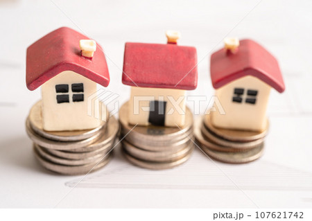 House model with stack of coin money, home loan, saving plan, installment payment finance and banking concept. 107621742