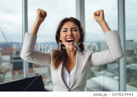 Happy businesswoman rejoices at a successful project Happy businesswoman rejoices at a successful project 107623443