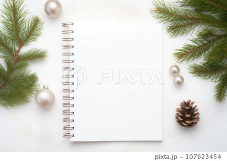 white blank flat lay empty mock up of open planner with christmas tree and decorations white blank flat lay empty mock up of open planner with christmas tree and decorations 107623454