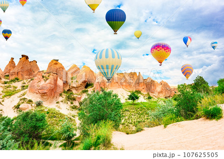 Fly of air balloons in Unique natural place - Cappadocia , Turkiye. Fly of air balloons in Unique natural place - Cappadocia , Turkiye. 107625505