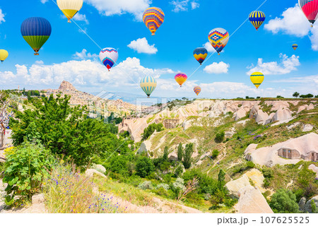 Fly of air balloons in Unique natural place - Cappadocia , Turkiye. Fly of air balloons in Unique natural place - Cappadocia , Turkiye. 107625525