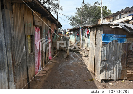Dirty streets of Kenyan slums in Nairobi 107630707