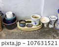 A terrace scene with a variety of pots 107631521