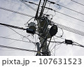 A telephone pole with complicated electrical wires 107631523