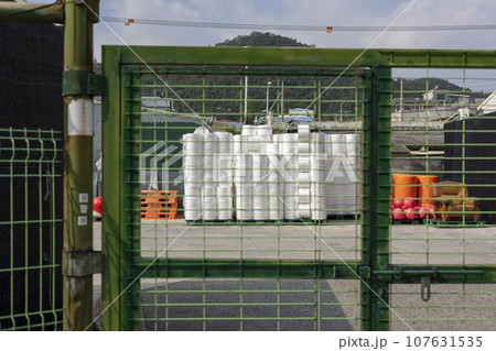 Fishing tools and props seen through the port city scenery and steel doors 107631535