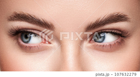 Beautiful female eyes with long eyelashes Beautiful female eyes with long eyelashes 107632279