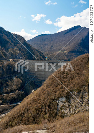 The dam of the Inguri hydroelectric power plant in the Sakartvelo mountains. A natural mountain landscape with energetic infrastructure The dam of the Inguri hydroelectric power plant in the Sakartvelo mountains. A natural mountain landscape with energetic infrastructure 107633727