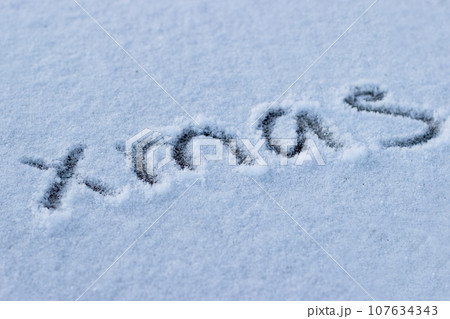 Inscription on the snow the word christmas 107634343