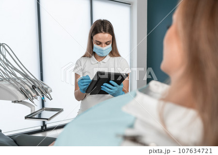 The patient provides the dentist with complete information about his complaints about dental health. The patient learns about the recommended treatment plan and possible methods of correcting the The patient provides the dentist with complete information about his complaints about dental health. The patient learns about the recommended treatment plan and possible methods of correcting the 107634721