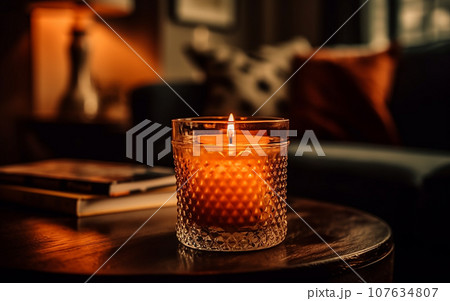 Closeup of burning candles spreading aroma on table Closeup of burning candles spreading aroma on table 107634807