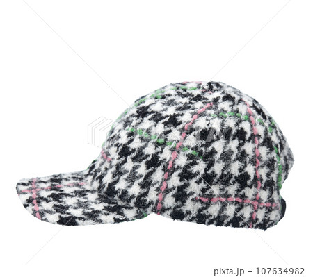 Cap-a baseball cap made of thick woolen fabric, with a visor, multi colored, isolated on a white background. Side view. Cap-a baseball cap made of thick woolen fabric, with a visor, multi colored, isolated on a white background. Side view. 107634982