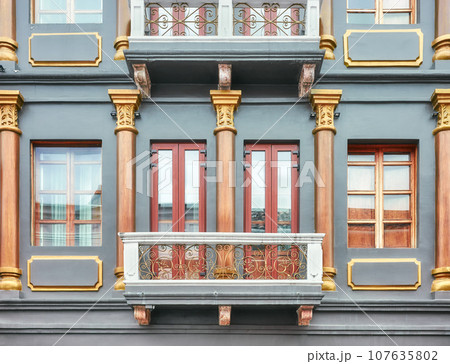 Street view of an old colonial building facade, architecture background, Cuenca, Ecuador. 107635802