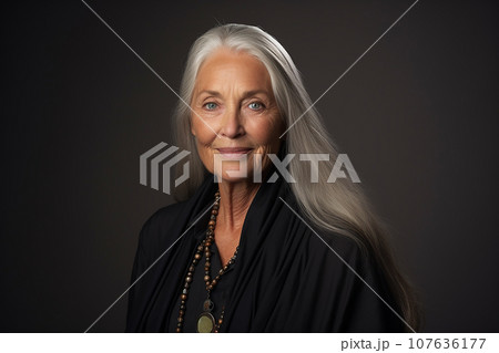 woman in her 60s against a plain background 107636177