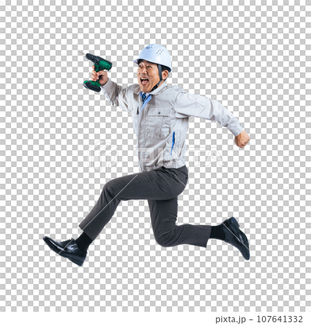 A middle-aged male worker jumping with an electric screwdriver, cutout background transparent PNG A middle-aged male worker jumping with an electric screwdriver, cutout background transparent PNG 107641332