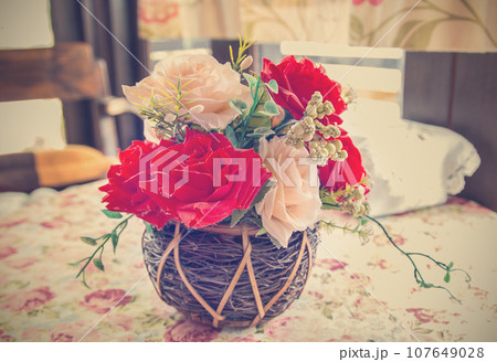 beautiful bouquet of bright flowers in basket 107649028