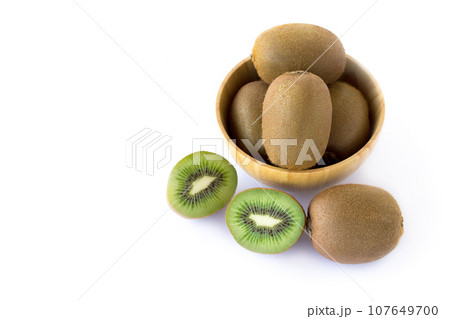 Fresh kiwi on a white background - close up Fresh kiwi on a white background - close up 107649700