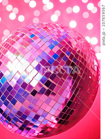 a disco ball on a pink background with white and blue lights in the background photo is taken from above stock photo 107659567