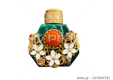 vintage perfume bottle of malachite glass with brass decorative braid made in Czechoslovakia 1960-70 on isolated white background 107664591