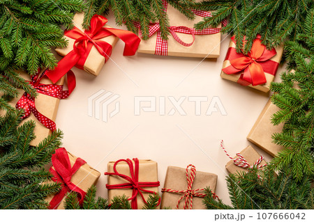 Xmas fir tree branch, Christmas gift boxes and space 107666042