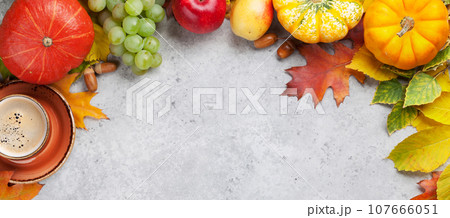 Autumn backdrop with pumpkins and fruits 107666051