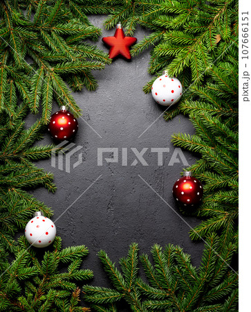 Christmas fir tree branch with decor and space 107666151