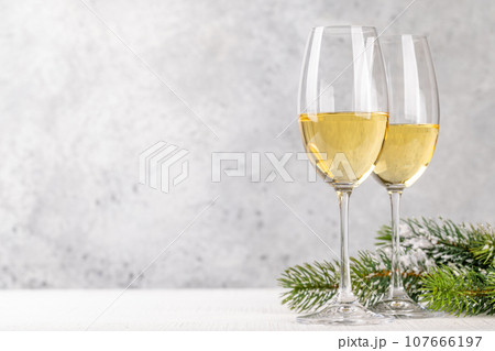 Christmas fir tree branches and champagne 107666197