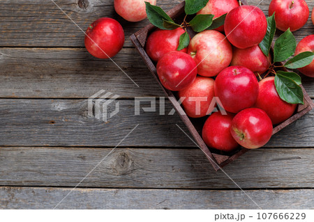 Wooden box with fresh red apples Wooden box with fresh red apples 107666229