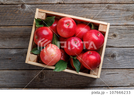Wooden box with fresh red apples Wooden box with fresh red apples 107666233