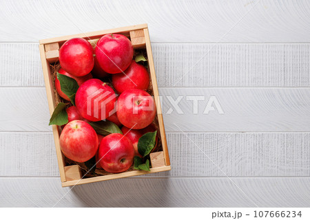 Wooden box with fresh red apples Wooden box with fresh red apples 107666234