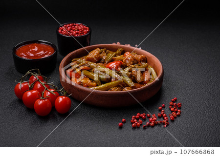 Mix of vegetables corn, carrots, peppers, onions in teriyaki sauce 107666868