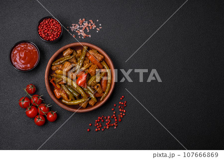 Mix of vegetables corn, carrots, peppers, onions in teriyaki sauce 107666869