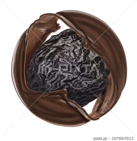Prune with chocolate splash isolated on white background Prune with chocolate splash isolated on white background 107667012