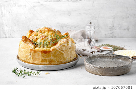 Baked cauliflower baked in puff pastry wit cheese . Delicious dish. Perfect tasty snack. copy space 107667681