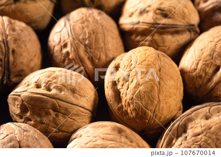 Walnuts in the shell on the table close-up 107670014