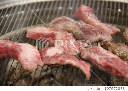 raw meat on grill 107672278