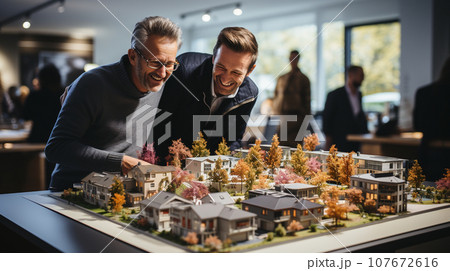 Gay Couple Discussing A New Housing Development Model on the Table In Front of Them. Generative AI. Gay Couple Discussing A New Housing Development Model on the Table In Front of Them. Generative AI. 107672616