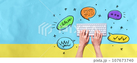 Speech bubbles and a computer keyboard Speech bubbles and a computer keyboard 107673740