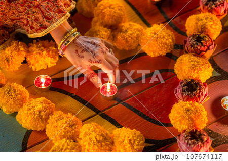 Happy Diwali - Diya lamps lit during diwali celebration Happy Diwali - Diya lamps lit during diwali celebration 107674117