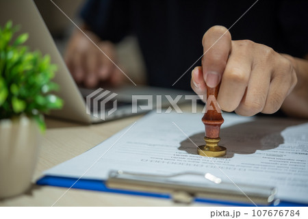 Contract law or paper work business and finance document rubber stamp. For official and legal contracts and agreements, financial statements, investment contracts, real estate documents. Contract law or paper work business and finance document rubber stamp. For official and legal contracts and agreements, financial statements, investment contracts, real estate documents. 107676784