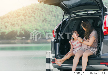 Summer vacation happy mother and daughter having fun. The concept of family on vacation and travel. Summer vacation happy mother and daughter having fun. The concept of family on vacation and travel. 107678041