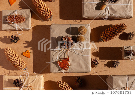 Zero waste Christmas knolling concept flat lay hard shadows. Hand craft eco gift natural New Year decorations top view. Zero waste Christmas knolling concept flat lay hard shadows. Hand craft eco gift natural New Year decorations top view. 107681755