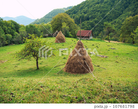 Old authentic wooden house hayloft Carpathian mountains Ukraine Europe Transcarpathia region. Eco tourism Cottagecore Old authentic wooden house hayloft Carpathian mountains Ukraine Europe Transcarpathia region. Eco tourism Cottagecore 107681798