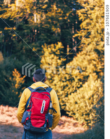 Man hiking with backpack Carpathian Mountains on scenic view Travel Lifestyle wanderlust adventure outdoor into the wild 107681909
