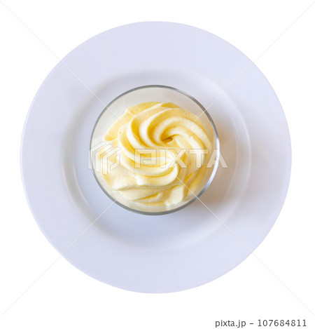There is portion of refreshing lemon sorbet in clear glass 107684811