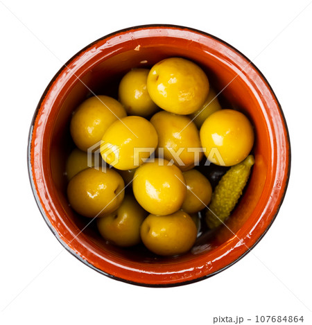Pickled green olives with cucumber - typical Spanish tapas olivas verdes y pepinos 107684864