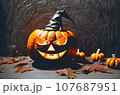 Orange pumpkin with a scary face wearing a black witch hat on Halloween. 107687951