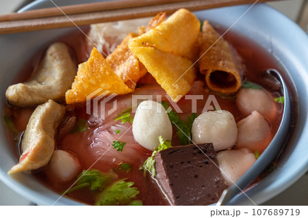 Large Yen Ta Fo Noodles on the Dining Table for Lunch. Large Noodles in Pink Soup, Asian Cousine 107689719