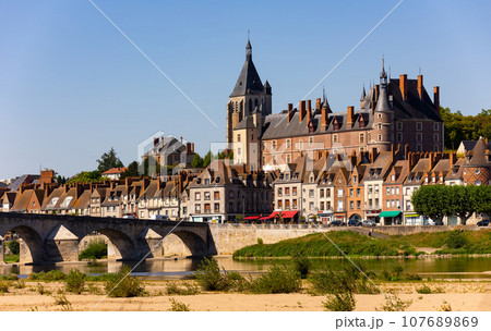 Gien cityscape on bank of Loire with medieval castle and arched bridge Gien cityscape on bank of Loire with medieval castle and arched bridge 107689869