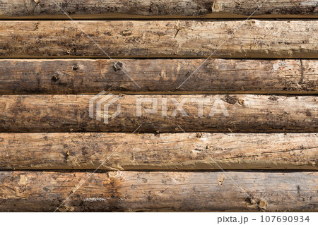 Wooden wall from logs Wooden wall from logs 107690934