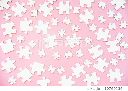 White puzzle pieces of different size 107691364